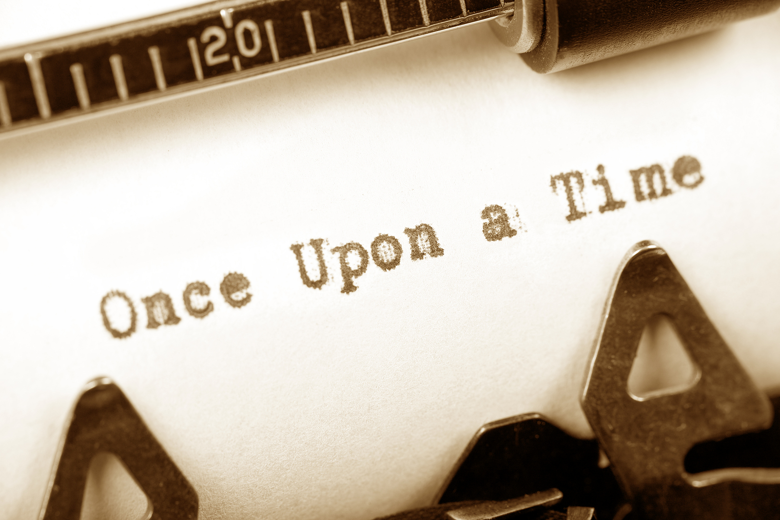 Close-up of a typewriter with a page reading Once Upon a Time